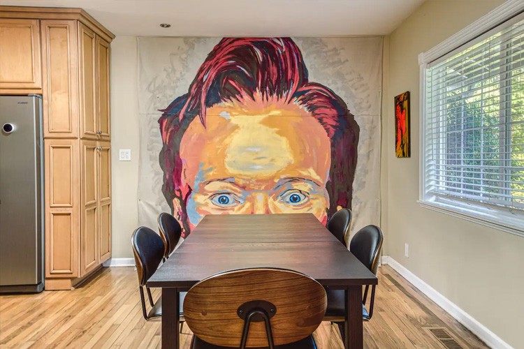 OMG! House · portrait mural and dining area — Project photograph