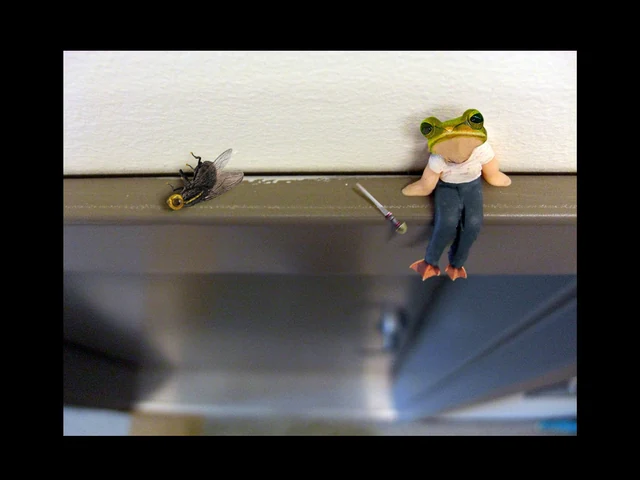 Small figure on a ledge